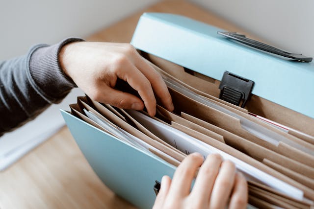 person going through documents